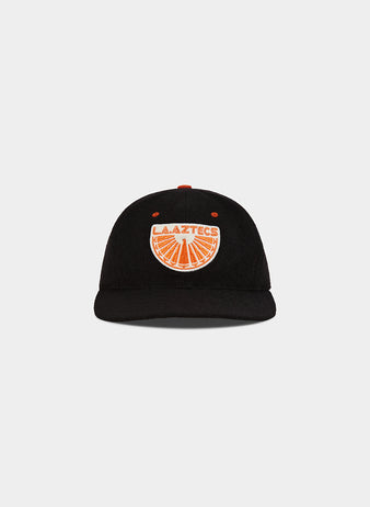 The Los Angeles Aztecs Wool Ballcap by Ebbets Field is a black cap with an orange and white embroidered patch on the front, displaying 
