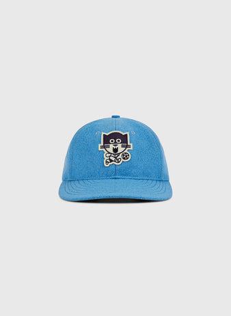The Ebbets Field Chicago Cats Wool Ballcap is a blue hat with an embroidered cartoon cat holding a wrench and a paw print on the front, shown against a plain light gray background.