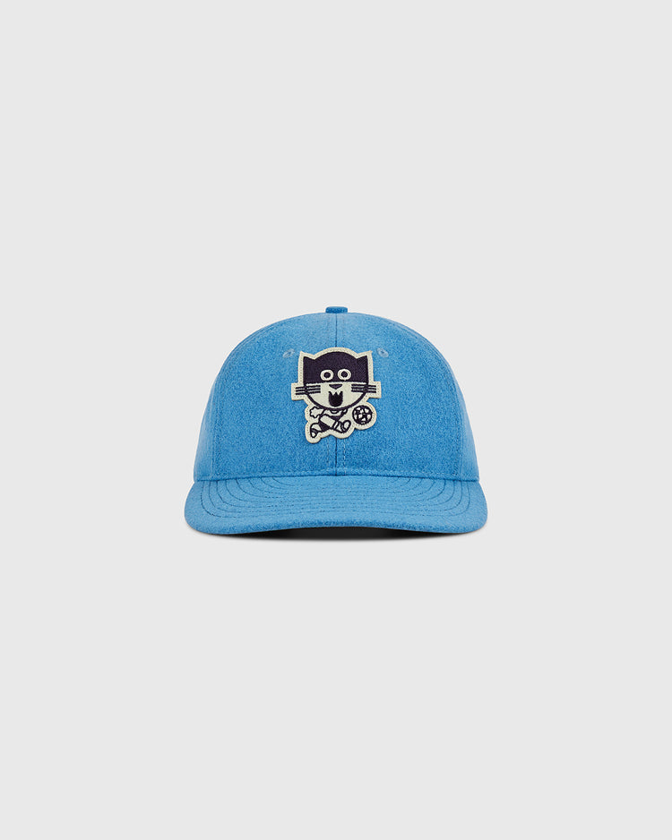 The Ebbets Field Chicago Cats Wool Ballcap is a blue hat with an embroidered cartoon cat holding a wrench and a paw print on the front, shown against a plain light gray background.