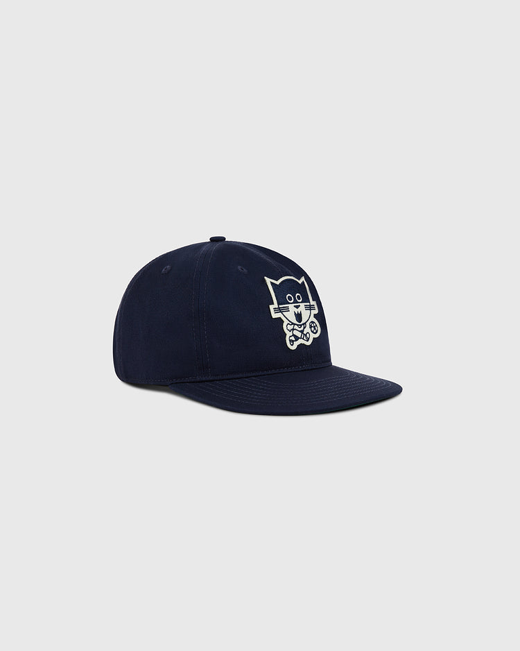 The Ebbets Field Chicago Cats Cotton Twill Ballcap in navy features an embroidered cartoon cat with a skateboard on the front, shown against a plain light gray background.