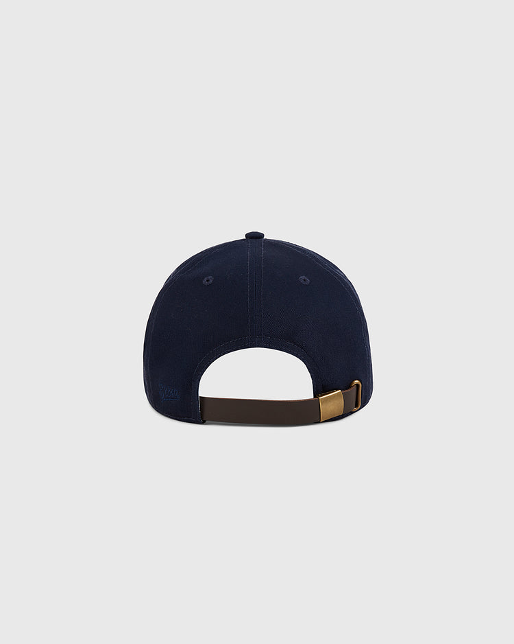 The Ebbets Field New York Cosmos Cotton Twill Ballcap is shown from the back, with a brown adjustable strap and gold buckle, set against a light gray background—a classic tribute to Cosmos style.