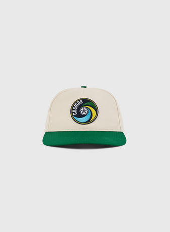 The Ebbets Field New York Cosmos A-Frame Cotton Twill Ballcap is a beige retro snapback with a green brim and front patch featuring Earth and 