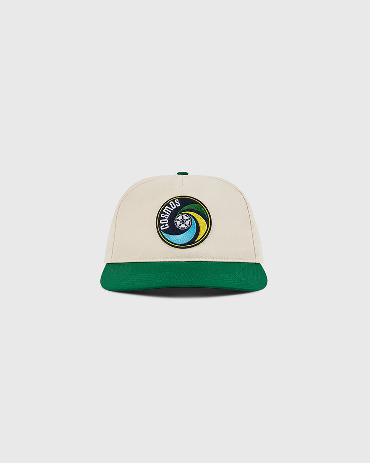 The Ebbets Field New York Cosmos A-Frame Cotton Twill Ballcap is a beige retro snapback with a green brim and front patch featuring Earth and 