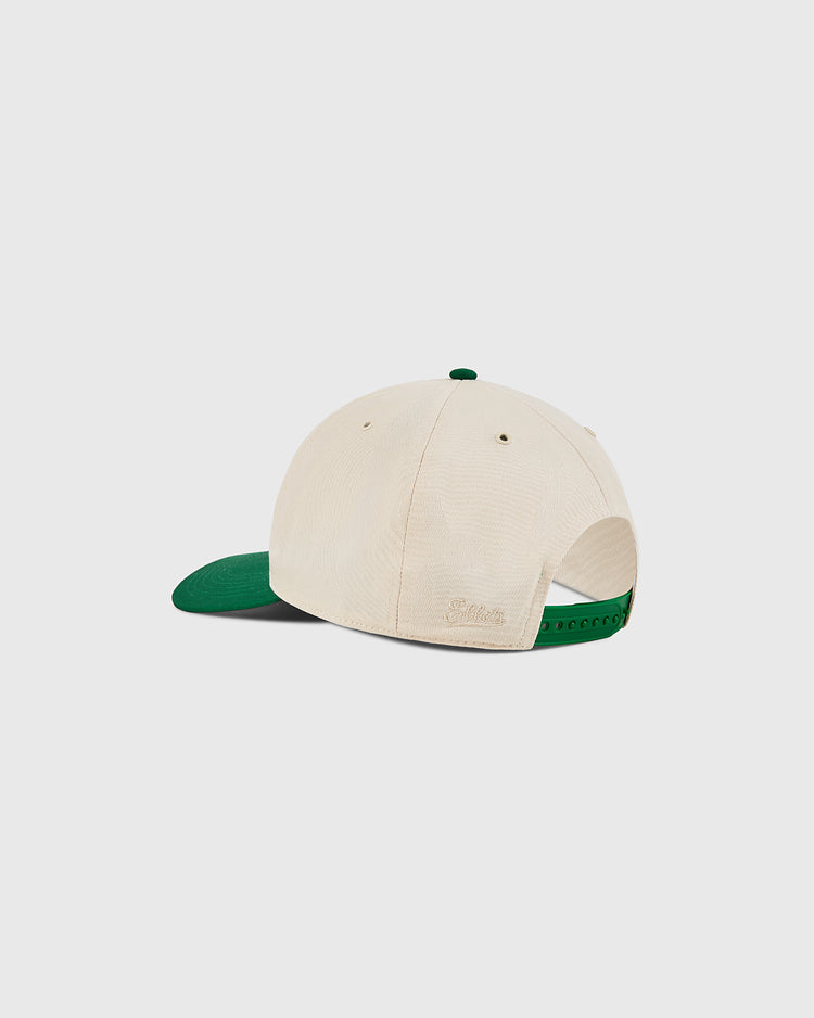 The Ebbets Field New York Cosmos A-Frame Cotton Twill Ballcap in beige features a green bill and retro snapback closure, shown from the back against a plain white background.
