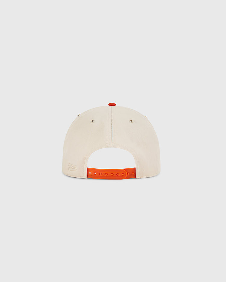The Los Angeles Aztecs A-Frame Cotton Twill Ballcap by Ebbets Field is a beige structured snapback, shown from the back with an adjustable orange strap. The cap is plain, without any visible logos or designs.