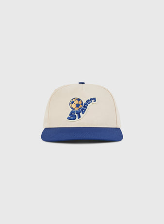 The Ebbets Field Pennsylvania Stoners A-Frame Cotton Twill Ballcap features a beige crown, blue brim, and a soccer ball logo above 