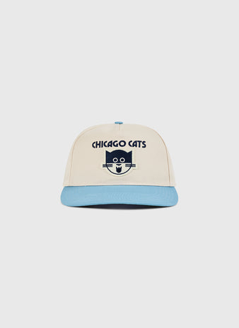 The Ebbets Field Chicago Cats A-Frame Cotton Twill Ballcap sports a beige and light blue retro look with a cartoon cat face and CHICAGO CATS text—perfect for American Soccer League fans and collectors.