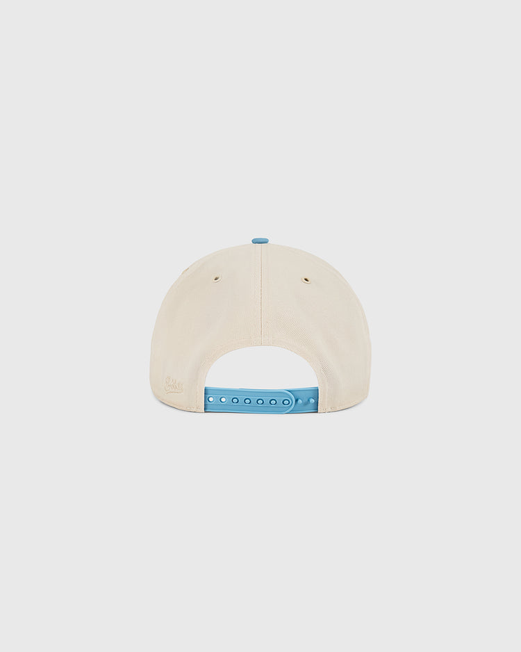 The Ebbets Field Chicago Cats A-Frame Cotton Twill Ballcap is shown from the back, highlighting its cream color, blue adjustable closure, and two ventilation holes against a plain white background for a classic vintage look.