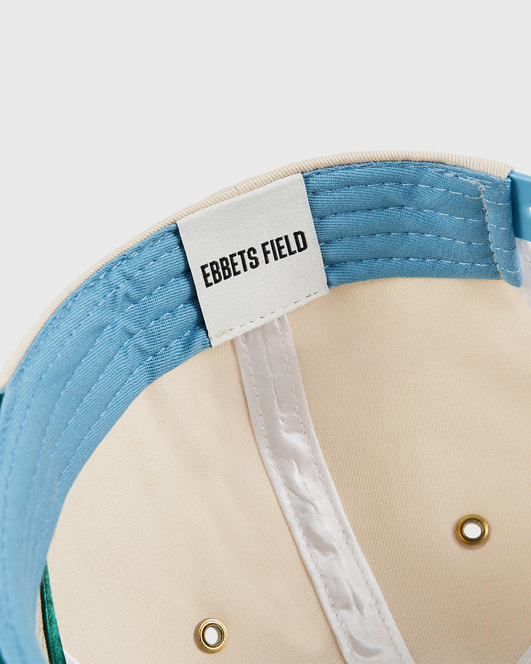 Close-up of the Chicago Cats A-Frame Cotton Twill Ballcap by Ebbets Field, showing the beige and blue interior with a white EBBETS FIELD label on the blue lining, plus gold rivets and detailed white stitching.