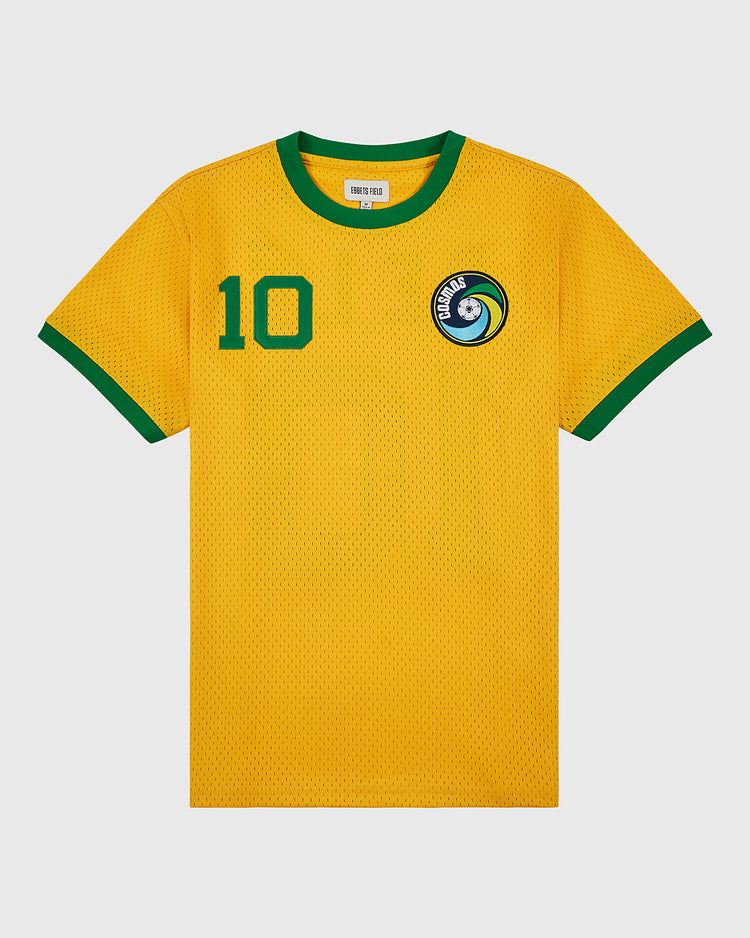 The Ebbets Field New York Cosmos Soccer Mesh Jersey is yellow with green collar and sleeve trim, inspired by Pelé’s iconic look, featuring a number 10 on the chest and a blue-and-white circular crest on the left side.