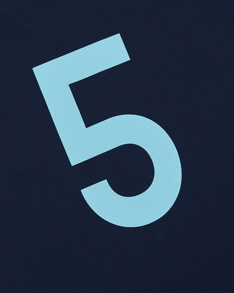 A large, light blue number 5 inspired by the classic Chicago Cats Vintage Collar Soccer Jersey from Ebbets Field is centered on a dark blue background.