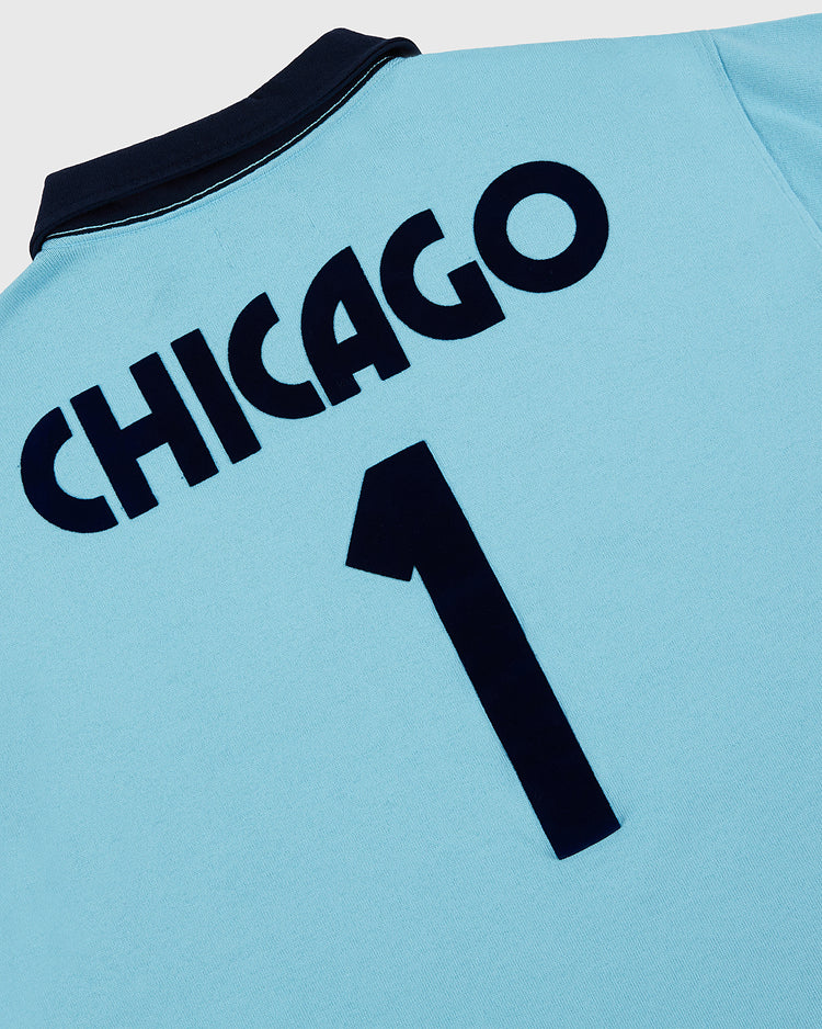 The Ebbets Field Chicago Cats Vintage Soccer Goalie Jersey features a light blue design with a dark collar, bold “CHICAGO” and number 1 on the back, inspired by classic American Soccer League long sleeve jerseys.