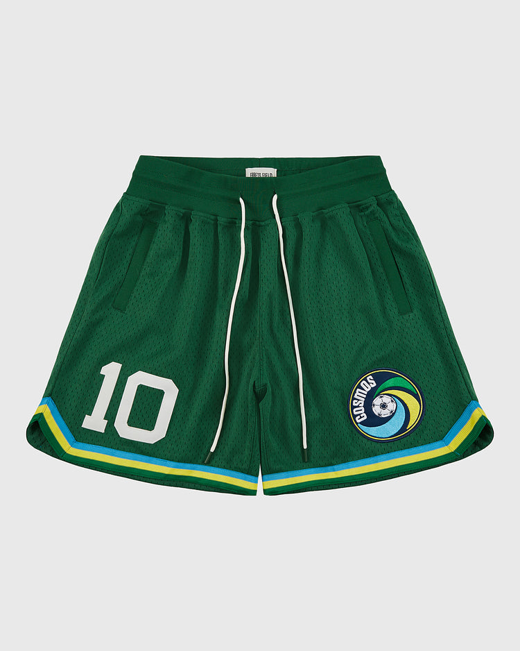 Ebbets Field New York Cosmos Mesh Soccer Shorts feature green mesh, a white drawstring, “10” on the left leg, and a Cosmos globe patch on the right. Yellow and blue hem stripes honor Pelé’s legendary style.