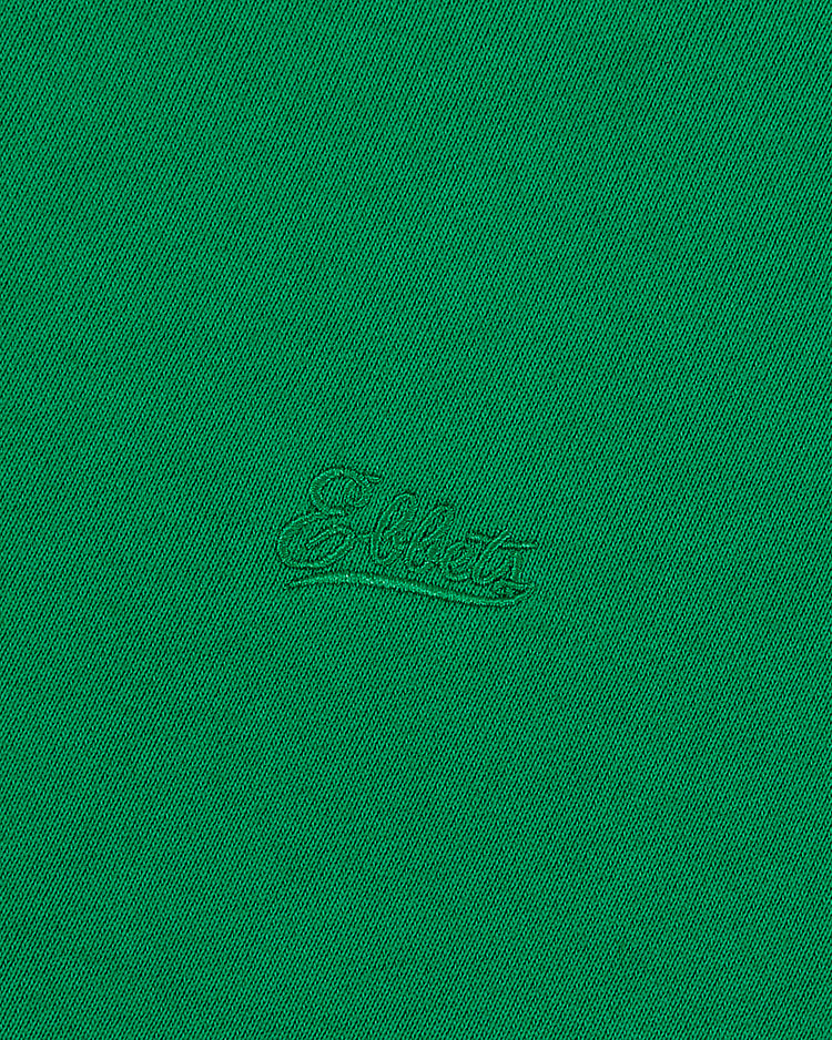 A close-up of green fabric from the Ebbets Field New York Cosmos Soccer Warm Up Jacket features 