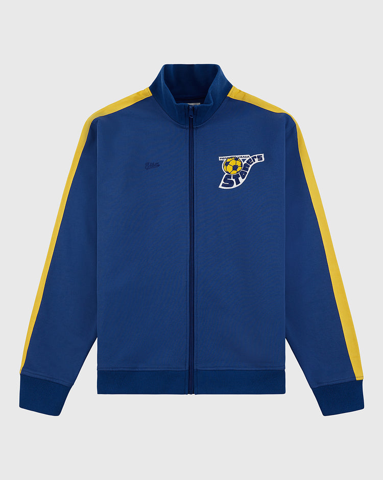 The Ebbets Field Pennsylvania Stoners Soccer Warm Up Jacket is blue with yellow sleeve stripes, a full front zipper, and features the team logo with 