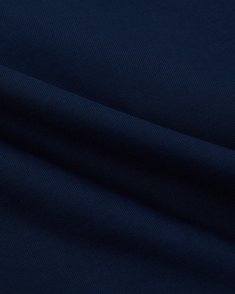 Close-up of dark navy blue fabric with a soft, smooth texture and fine weaving details—ideal for the Ebbets Field Chicago Cats Soccer Warm Up Jacket.
