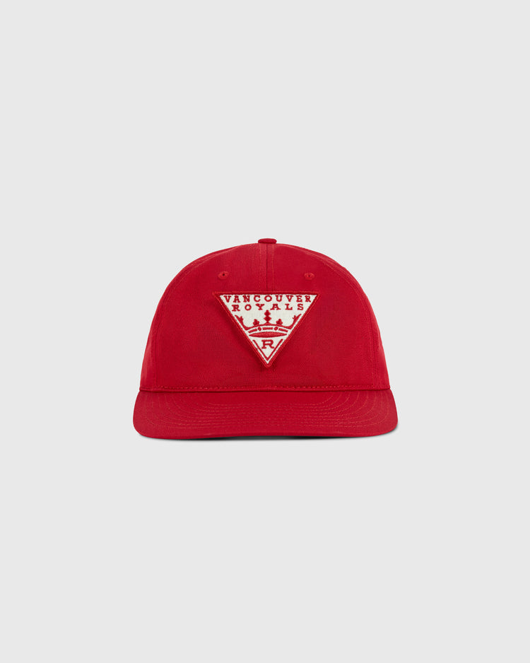 The Ebbets Field Vancouver Royals Cotton Twill Ballcap is red with a front triangular patch displaying “Vancouver Royals,” a skyline graphic, and a small VR logo.