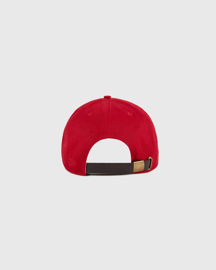 The Ebbets Field Vancouver Royals Cotton Twill Ballcap, shown from the back on a light gray background, features red cotton twill and a dark adjustable strap with a brass buckle.