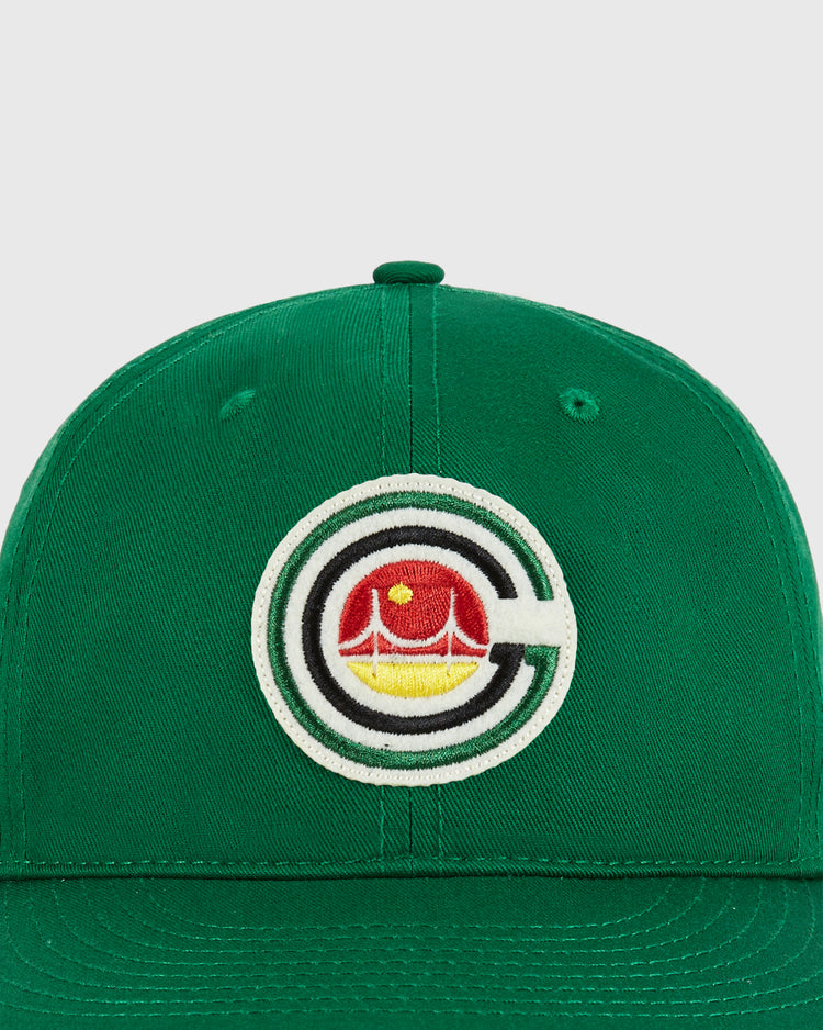 The Ebbets Field San Francisco Golden Gate Gales Cotton Twill Ballcap is a green cap with an embroidered circular logo featuring a stylized 