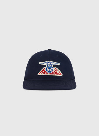 The Ebbets Field New Jersey Americans Cotton Twill Ballcap is navy blue with a front patch of a blue eagle holding a soccer ball over 
