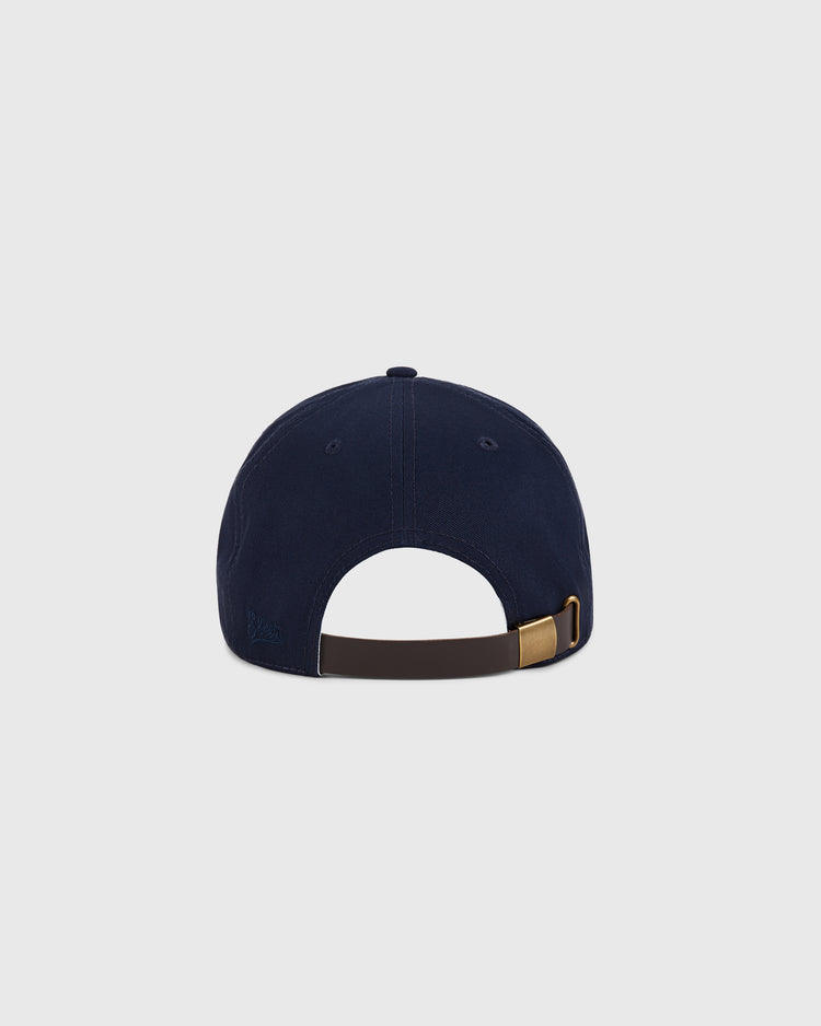 The Ebbets Field New Jersey Americans Cotton Twill Ballcap is shown from the back, highlighting its adjustable brown strap with a brass buckle and an open section above it, set against a plain light gray background.