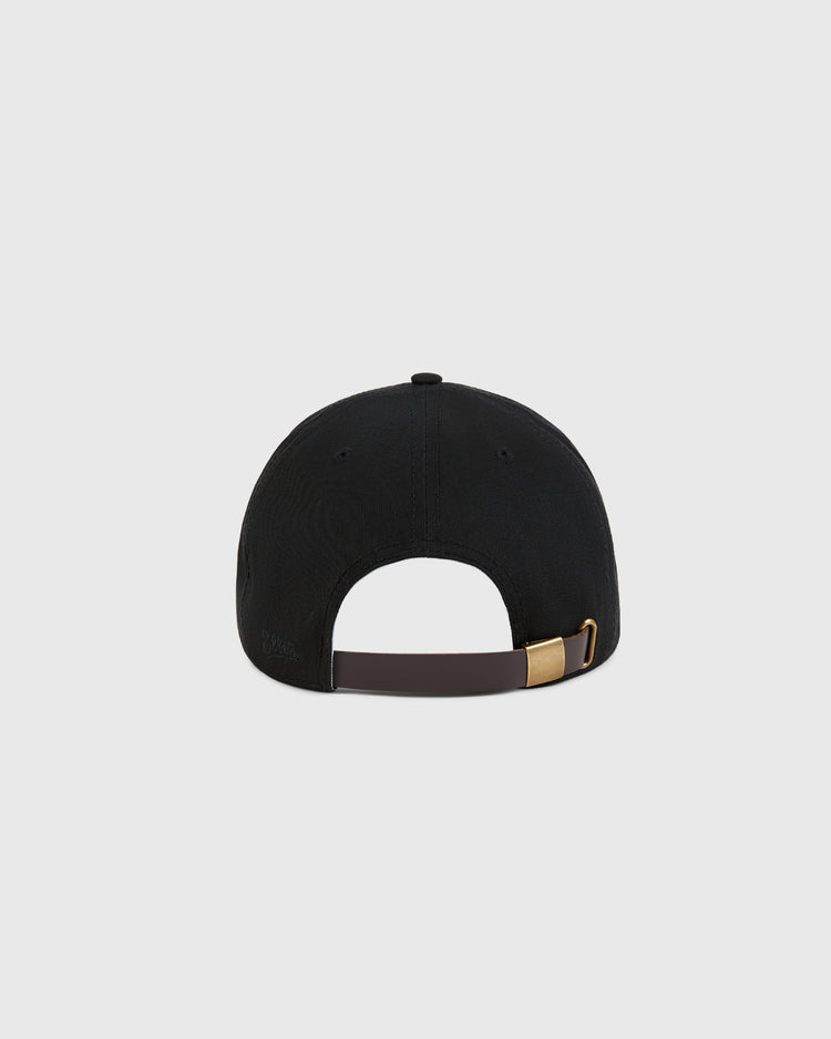 The Ebbets Field Detroit Cougars Cotton Twill Ballcap is shown from the back, featuring a brown adjustable strap with a gold buckle and black cotton twill fabric, inspired by the classic NASL era design.