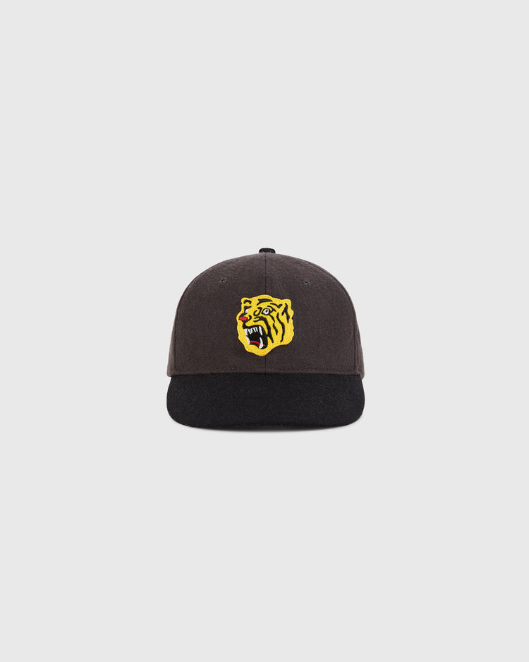 The Ebbets Field Osaka Tigers 1940 Wool Ballcap for youth features a dark design with a black brim and a yellow snarling tiger face on the front, shown against a plain light background.