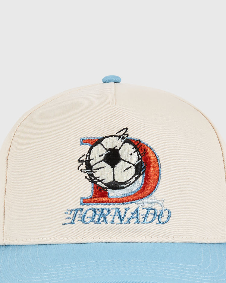 The Ebbets Field Dallas Tornados A-Frame Cotton Twill Ballcap features a beige retro look, light blue brim, embroidered red D, black and white soccer ball, and TORNADO in blue—honoring the iconic NASL champions.