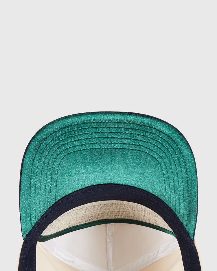 Close-up of the Ebbets Field New Jersey Americans A-Frame Cotton Twill Ballcap, green and black, embroidered, shown from above to display the inside crown and underside of its curved brim against a plain light background.