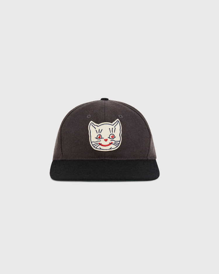 The Ebbets Field Kansas City Katz 1961 Wool Ballcap features a dark gray crown, black brim, and an embroidered white cartoon cat face with red eyes and nose—perfect for fans of the classic team.