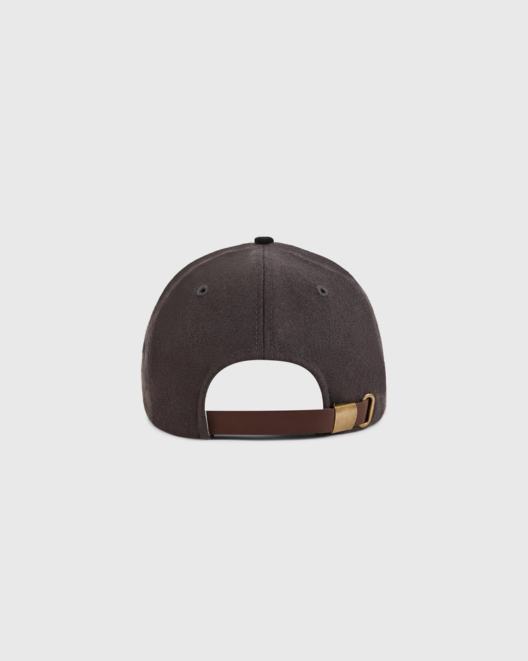 The Kansas City Katz 1961 Wool Ballcap by Ebbets Field is shown from the back in dark gray, featuring a brown adjustable strap with brass buckle, set against a plain light background.
