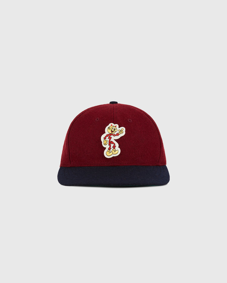 The Ebbets Field Reddy Kilowatt 1940 Wool Ballcap for youth features maroon wool, a navy brim, and a cartoon patch on the front, shown against a plain light background.