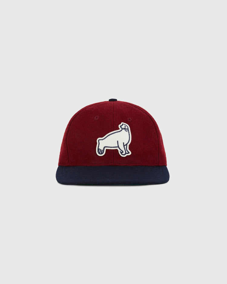 The Ebbets Field San Francisco Seals 1940 Wool Ballcap features burgundy wool, a navy brim, and a white embroidered sea lion patch, inspired by the historic team. Shown here against a plain light gray background.