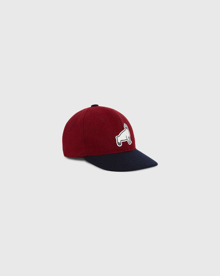 The Ebbets Field San Francisco Seals 1940 Wool Ballcap (Youth Size) features a burgundy crown, navy blue curved brim, and a white embroidered dog patch on the front.