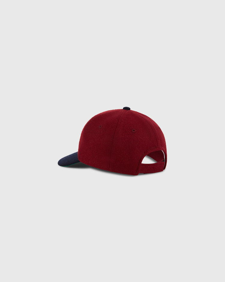 The Ebbets Field San Francisco Seals 1940 Wool Ballcap (Youth Size) is shown from the back, highlighting its red and navy blue colors and adjustable strap opening against a plain light gray background.