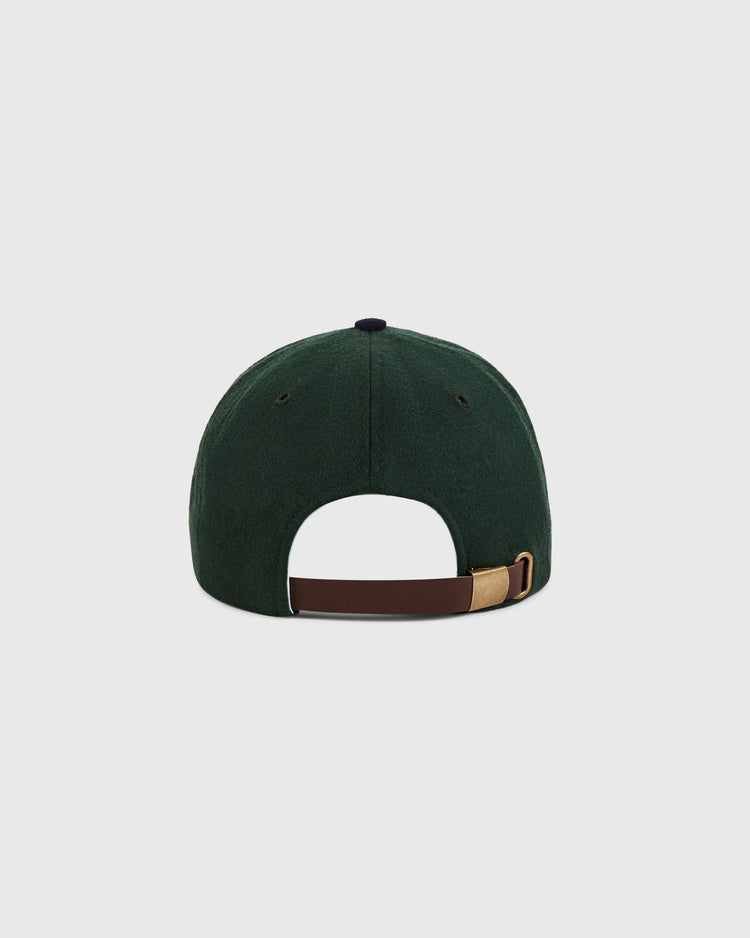The Ebbets Field Brooklyn Eagles 1935 Wool Ballcap for youth is shown from the back, in dark green wool with a brown leather strap and brass buckle, inspired by classic Negro Leagues designs. Plain white background.
