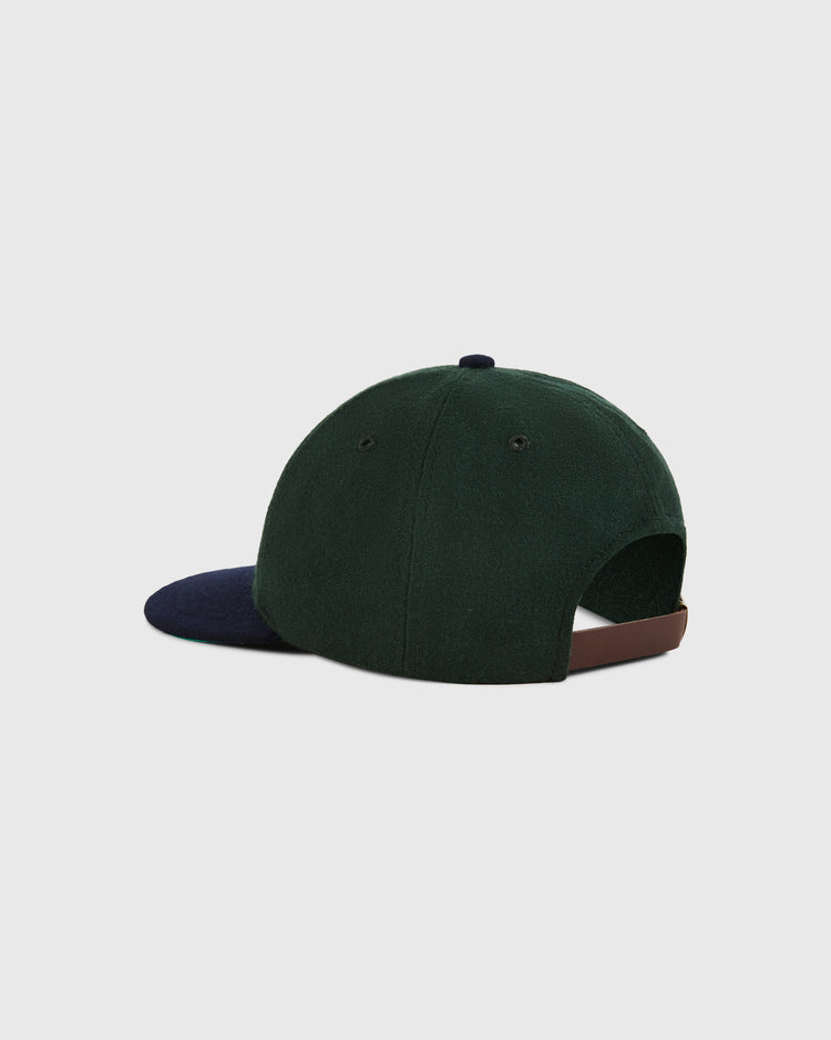 The Ebbets Field Brooklyn Eagles 1935 Wool Ballcap for youth features dark green wool, a navy blue brim, and a brown adjustable strap, inspired by the BK Eagles Negro Leagues hat, shown on a plain light background.