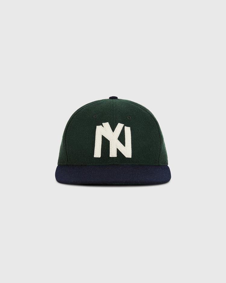 The Ebbets Field Brooklyn Eagles 1935 Wool Ballcap (Youth Size) features green wool, a navy brim, and a large white NY logo inspired by classic Negro Leagues hats, shown on a plain light gray background.