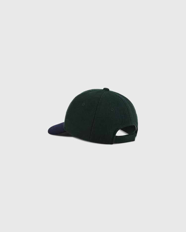 The BK Eagles 1935 Authentic Ballcap by Ebbets Field is dark green with a navy brim, shown from the back at an angle. It features a fabric strap and an opening above it. The background is plain white.