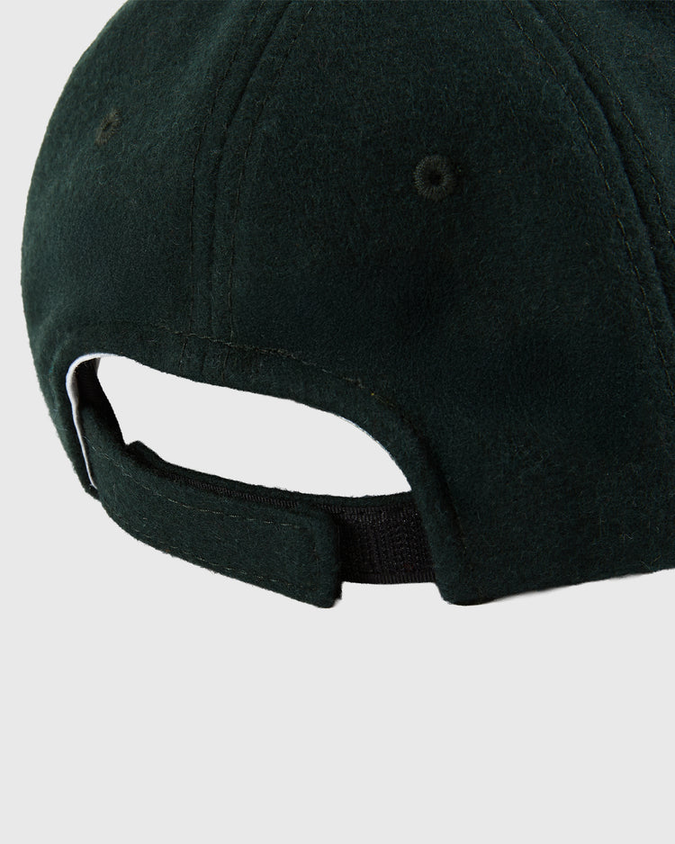 Close-up of the back of the BK Eagles 1935 Authentic Ballcap by Ebbets Field, featuring a dark green fabric strap with hook-and-loop fastener for adjustment and stitched ventilation holes.