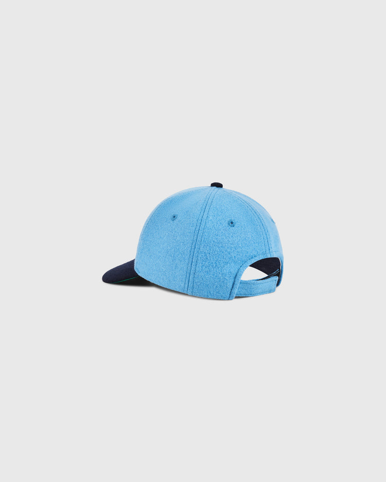 The Ebbets Field Santurce Cangrejeros Crab Wool Ballcap (Youth Size) is light blue with a navy brim, shown from the back. It features an open back with adjustable strap, inspired by the classic Santurce Cangrejeros style.
