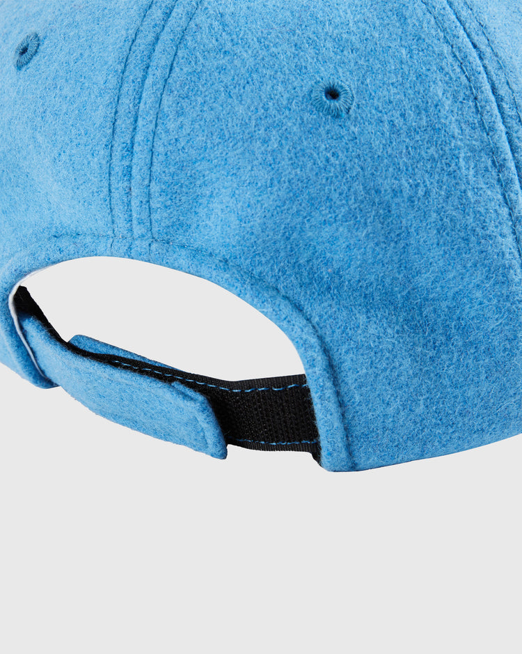 Close-up of the back of the Ebbets Field Santurce Cangrejeros Crab Wool Ballcap - Youth Size in light blue fleece, featuring a black adjustable strap with Velcro closure against a plain white background.