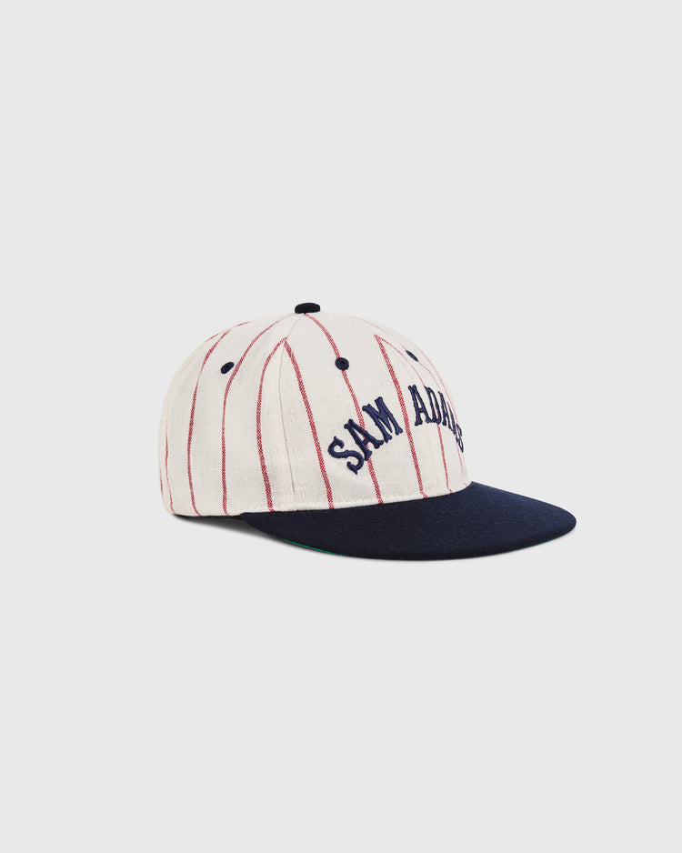 The Sam Adams Pinstripe Wool Ballcap by Ebbets Field features white wool pinstripes, a navy brim, and 