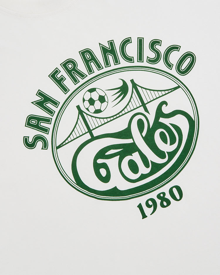 The Ebbets Field San Francisco Golden Gate Gales Short Sleeve Graphic T-Shirt features a green 1980 bridge and soccer ball design—perfect for fans of vintage soccer history and the iconic Gales team.