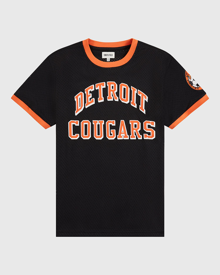 The Detroit Cougars Mesh Soccer Jersey by Ebbets Field is a black short-sleeve jersey with an orange collar and trim, DETROIT COUGARS in bold orange and white on the front, and a left sleeve patch—a vintage soccer classic.