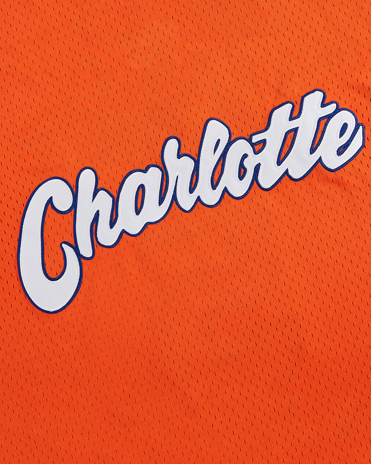 Crafted from orange textured mesh fabric, the Ebbets Field Cal Ripken Jr. Charlotte Orioles Mesh V-Neck Jersey features 