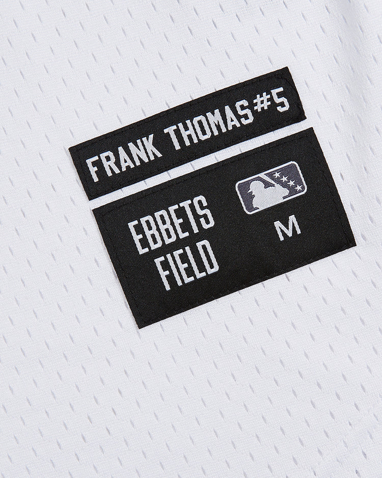 Close-up of the Ebbets Field Birmingham Barons Frank Thomas Button Up Mesh Jersey in white mesh, featuring two black patches: one with 