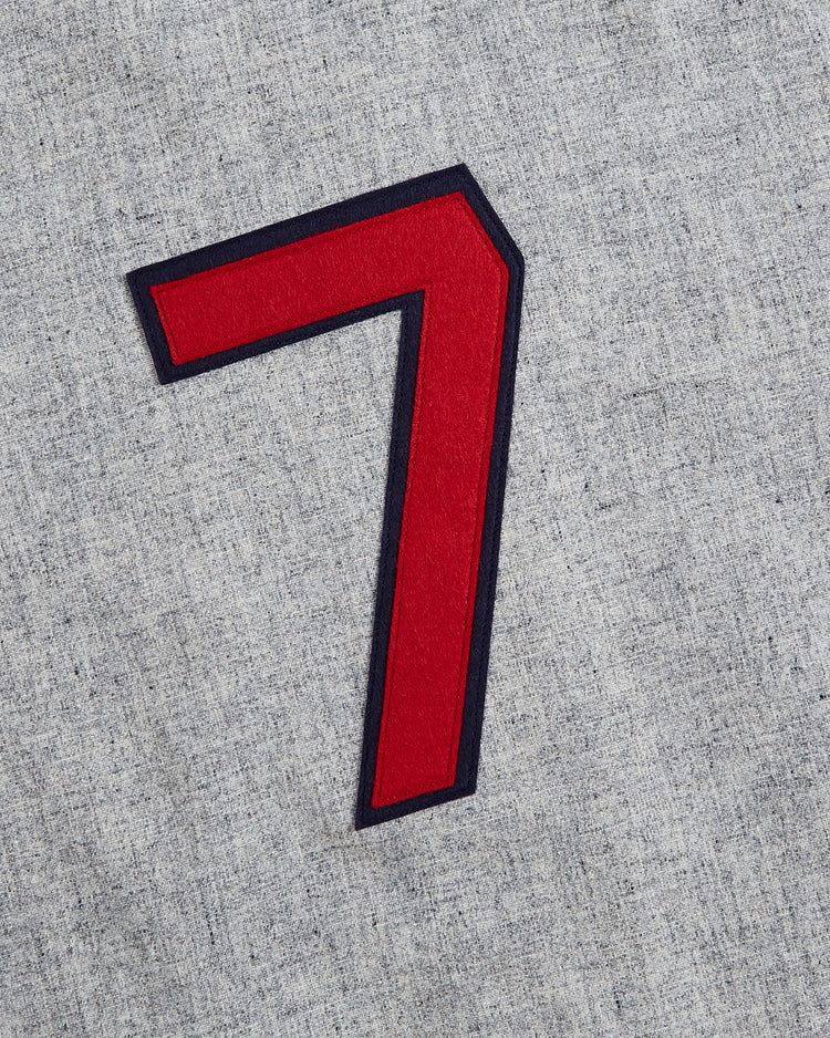 A bold red number seven with a black outline is featured on the light gray, textured fabric of the Philadelphia Stars 1939 Wool Authentic Road Jersey by Ebbets Field, evoking the look of classic Negro League uniforms.