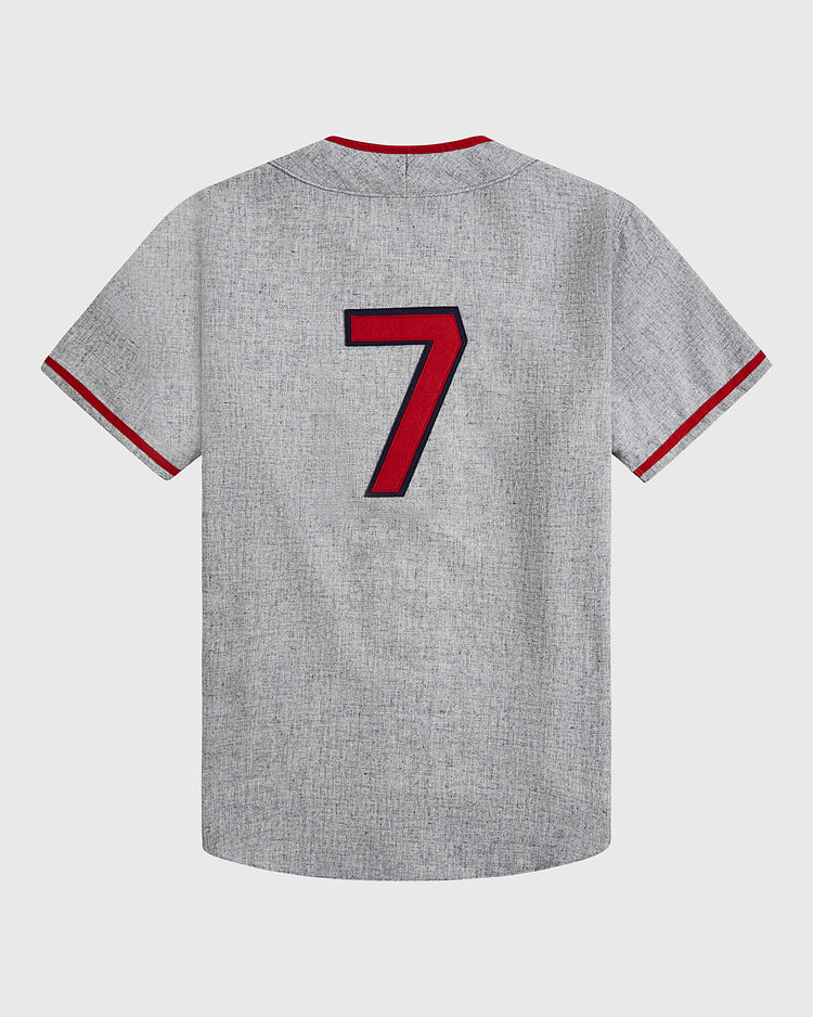 The Ebbets Field Philadelphia Stars 1939 Wool Authentic Road Jersey is a gray short-sleeve shirt with red and navy trim on the sleeves and collar, featuring a large red and navy number 7 on the back—an homage to an authentic wool road jersey inspired by classic Negro League baseball styles.