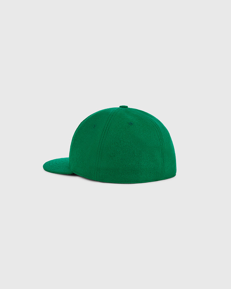 The Xalapa Chileros 1963 Authentic Wool Ballcap by Ebbets Field is displayed from the back on a light gray background. This cap features a plain green design with a slightly curved brim and has no visible logos, text, or patterns.